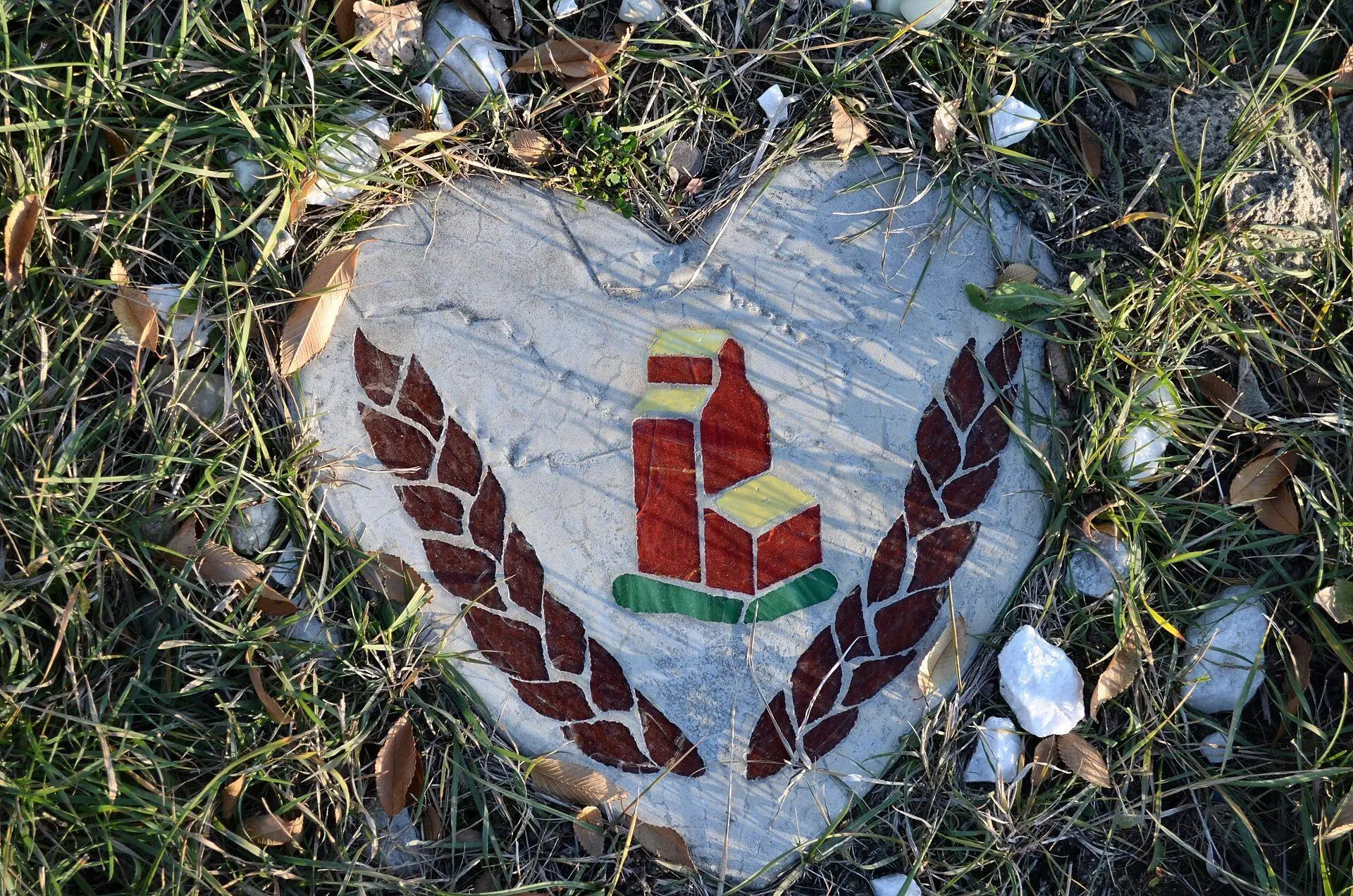Heart-shaped grave marker with grain elevator and wheat
